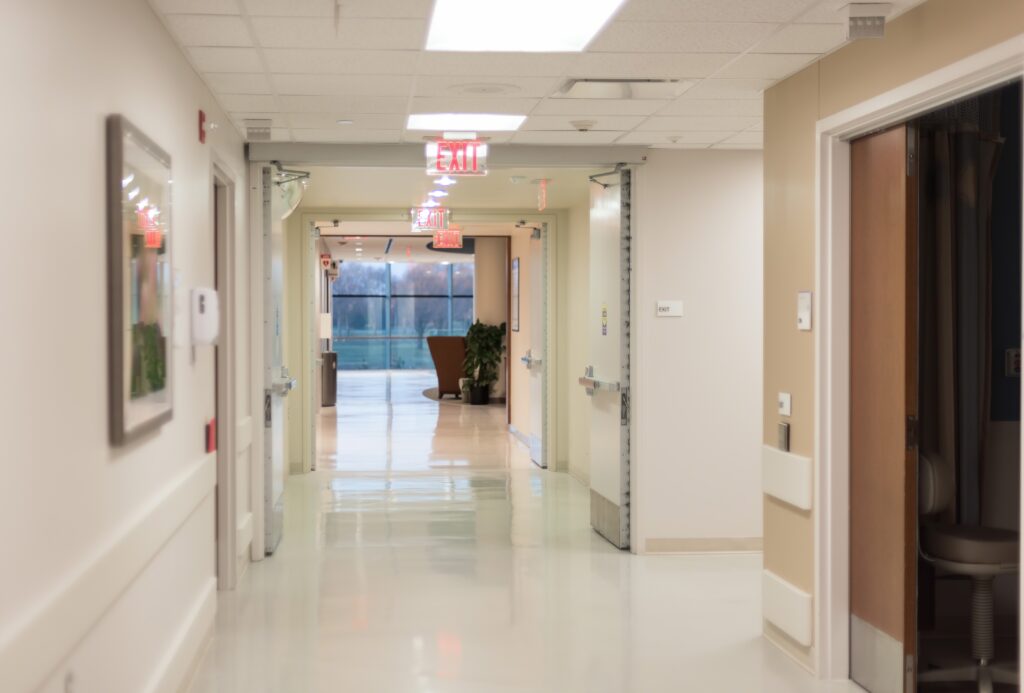 Hospital hallway with bright flourescent lights